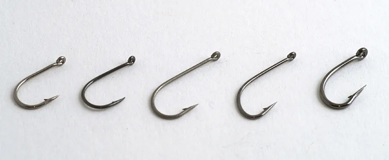 Tube single hooks - Singles work fine on tubes provided they are fairly short shanked and have a small, straight eye. Singles specifically made for tubes are rare, but luckily many bait and saltwater hooks will do the job. These hooks are from Kamasan, Partridge, Scierra and Owner.